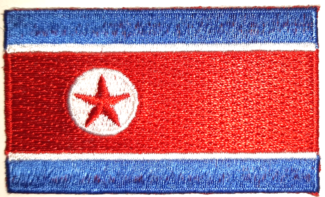 NORDKOREA TYGMÄRKE 65x38mm